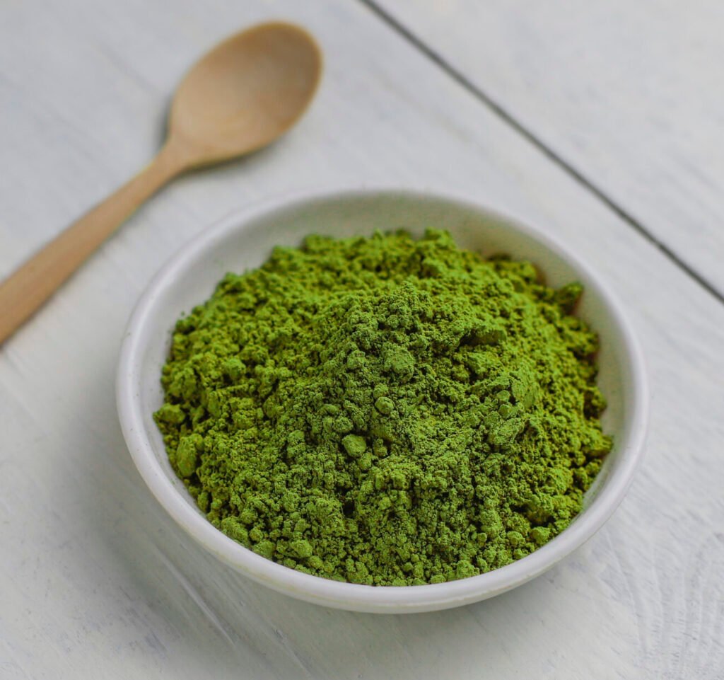 Word matcha made of powdered matcha green tea and bamboo spoon o